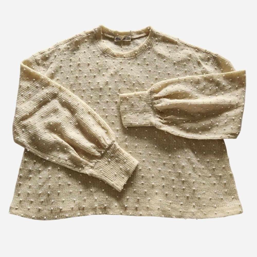 Light yellow popcorn sweater with puffy long sleeves  and white bobbles
